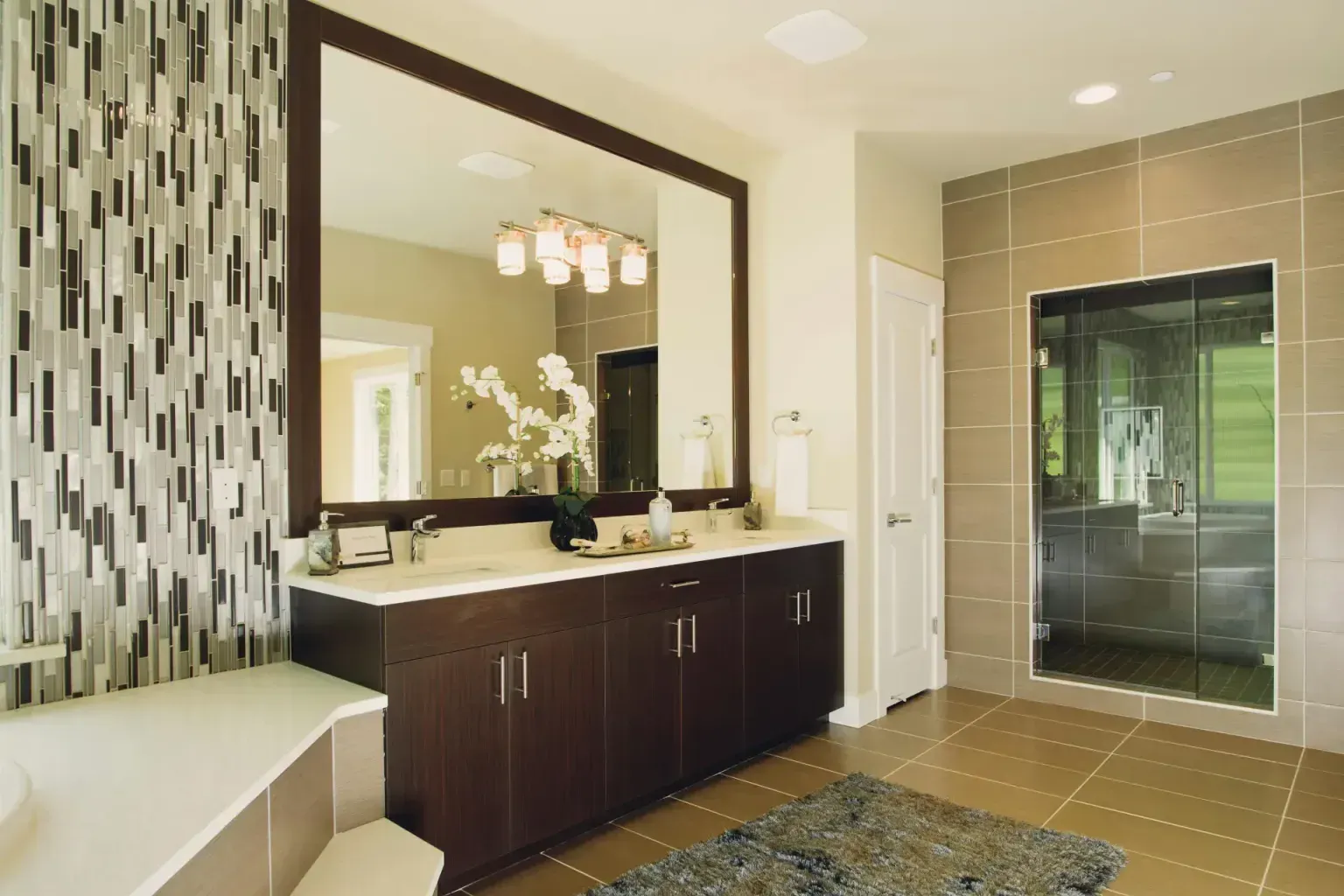 Bathroom remodel financing — a hand held flat against newly completed work to show how well it matches
