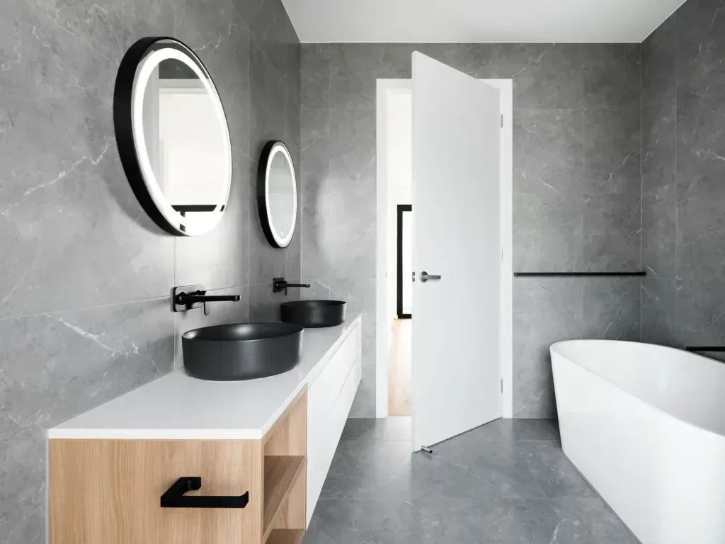 Bathroom remodel in San Antonio Tx — a perfectly true finished edge with warm light grazing along it
