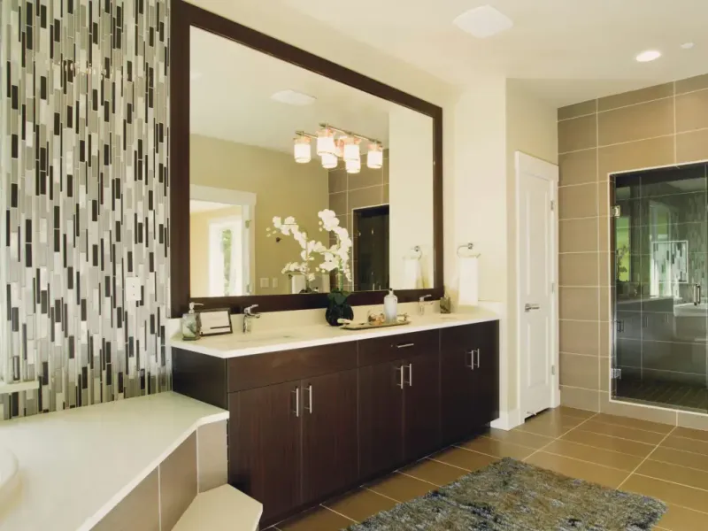 Bathroom remodel in San Antonio Tx — a craftsperson holding a sample board of three finish options
