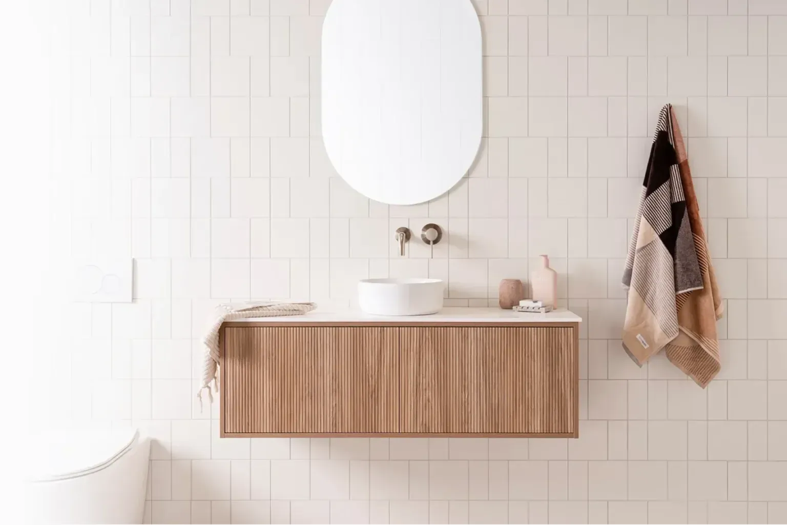 Wheelchair accessible bathroom — clean unbroken lines of completed work running toward a commercial suite window