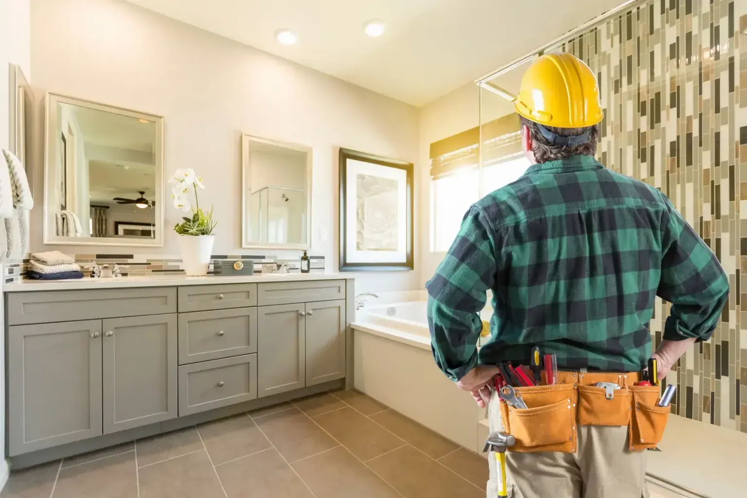 Bathroom remodel in Live Oak Tx — gloved hands easing along a crisp finished edge